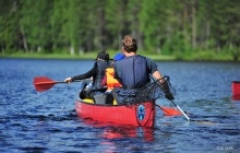 canoeing a lake in Finland