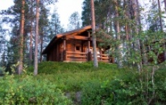 traditional wooden chalet hidden in the Finnish woods